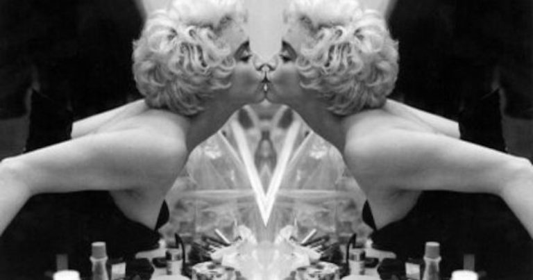 Mirror image of Madonna kissing herself
